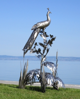 Peacock on tree garden sculpture